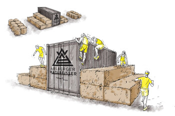 Illustration of stacked rectangular hay bales. A large container with the event logo sits on top of the bales. The arrangement forms a staircase with a high central platform that must be climbed over.